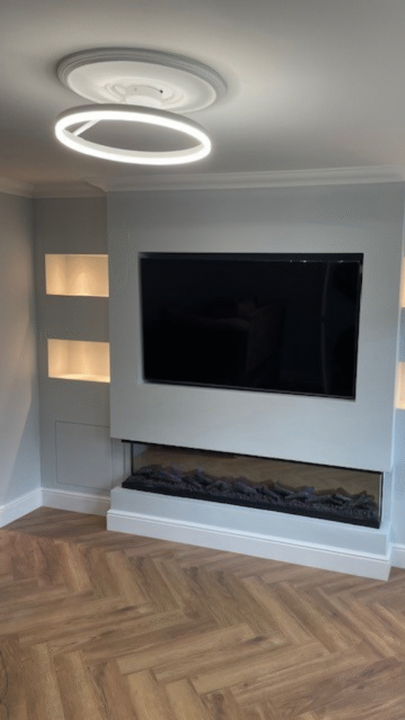Built-in media wall with fireplace, TV, and LED lighting